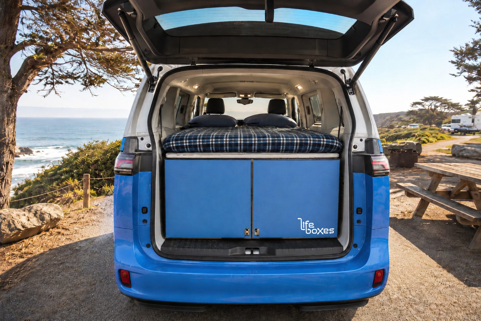 Blue LifeBox sleeper beside the ocean